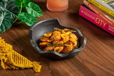 Gunpowder idli which is stir-fried in pure ghee and seasoned with traditional milagai podi masala, cashews and fragrant curry leaves